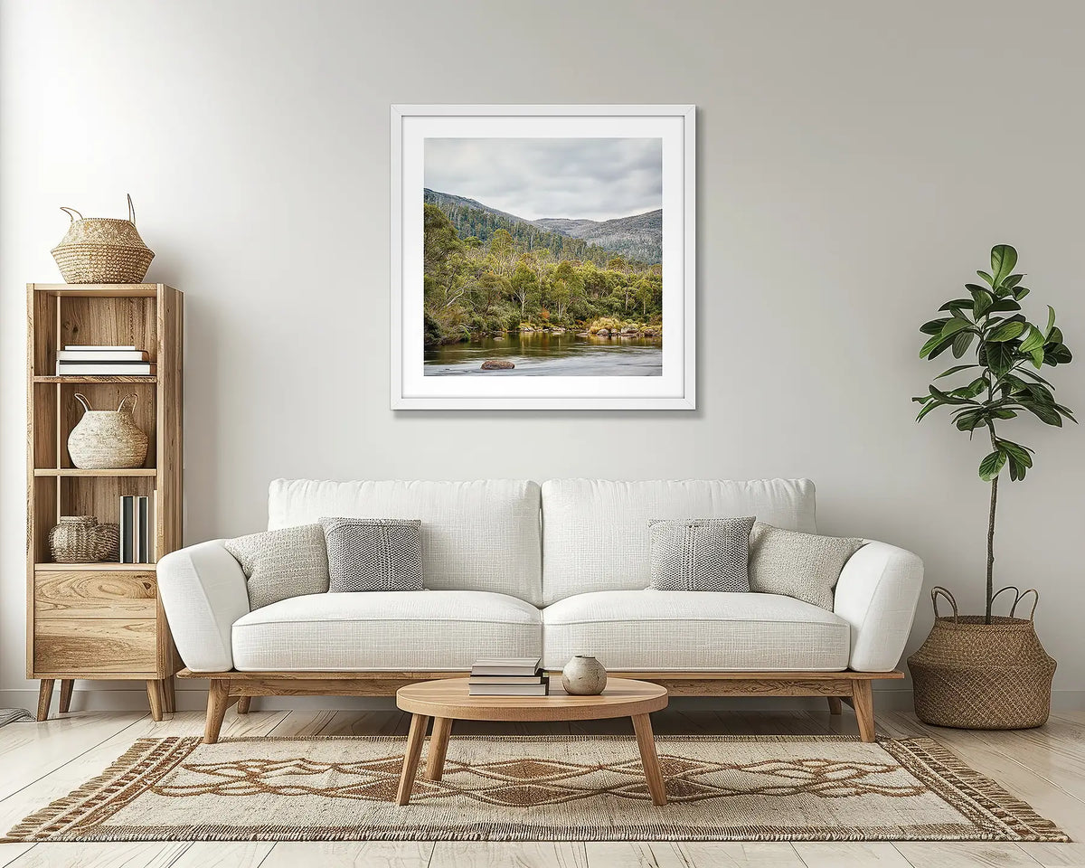 Escape to Nature. Thredbo river wall art print, with a white frame, in a lounge room. 