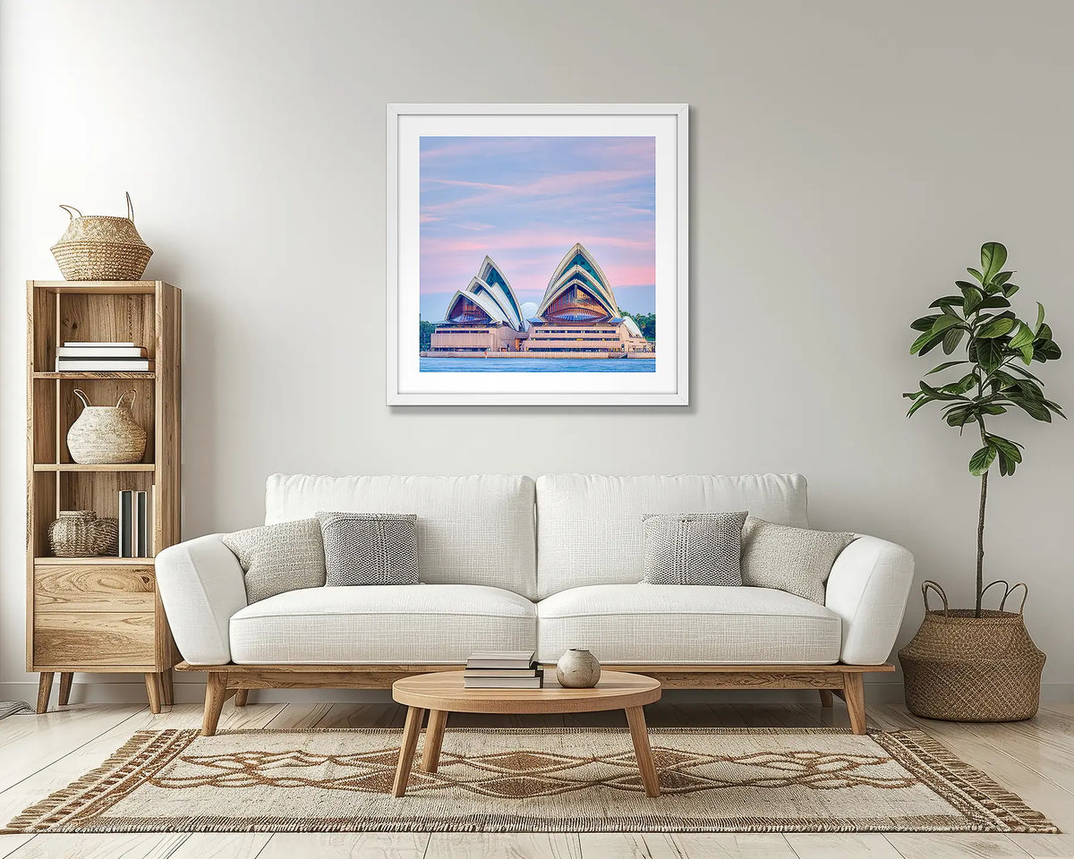 Evening at the Opera. Sydney Opera House wall art print, with a white frame, in a lounge room. 