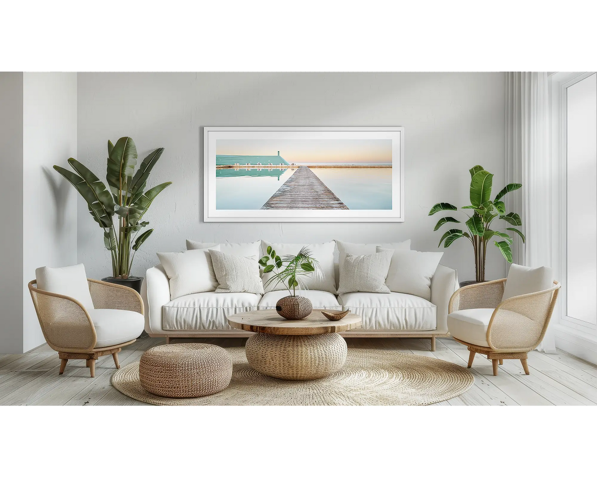 Evening Swim. Newcastle coastal wall art in a white frame, in a lounge room.