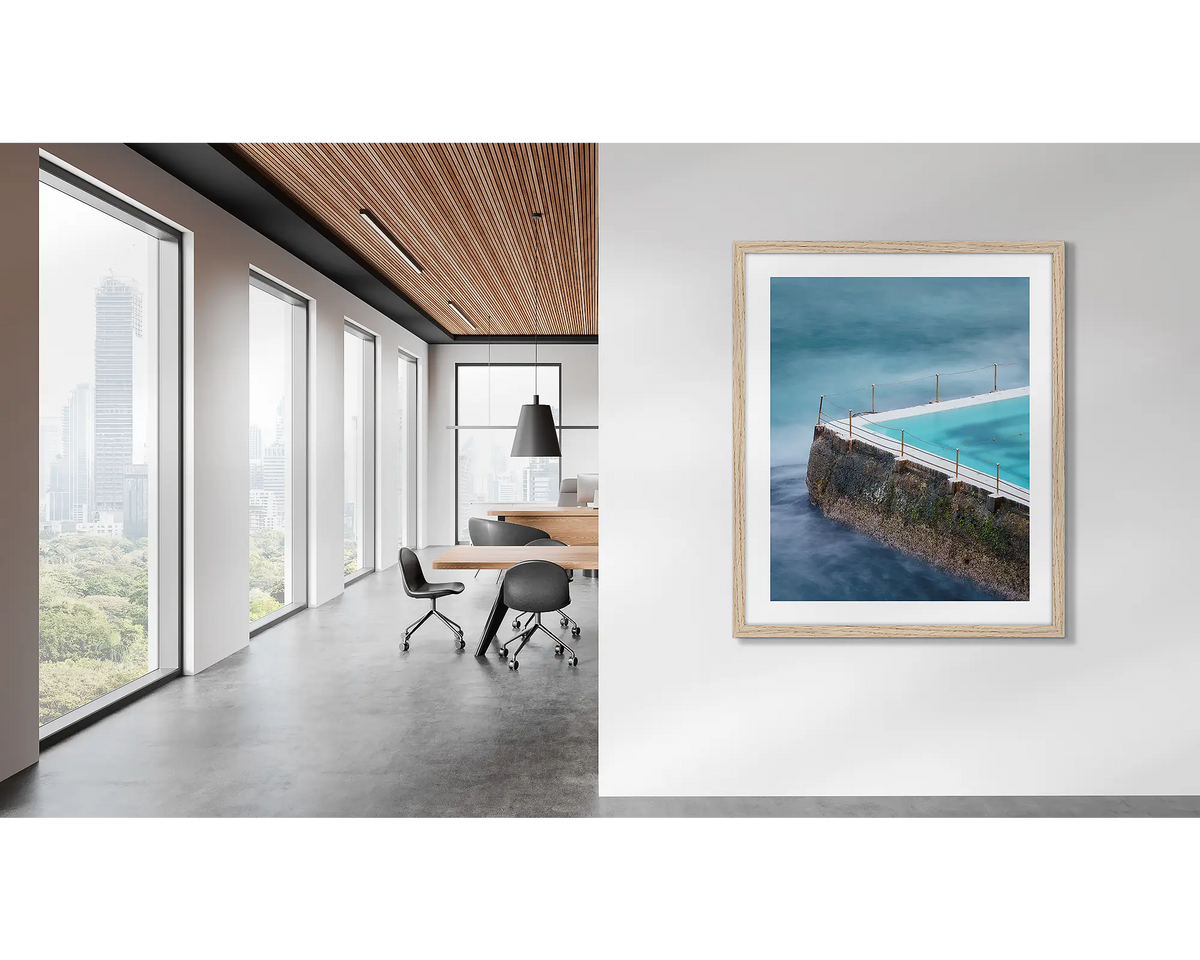 Fenced In. Bondi Icebergs artwork in an oak frame, on an office wall. 