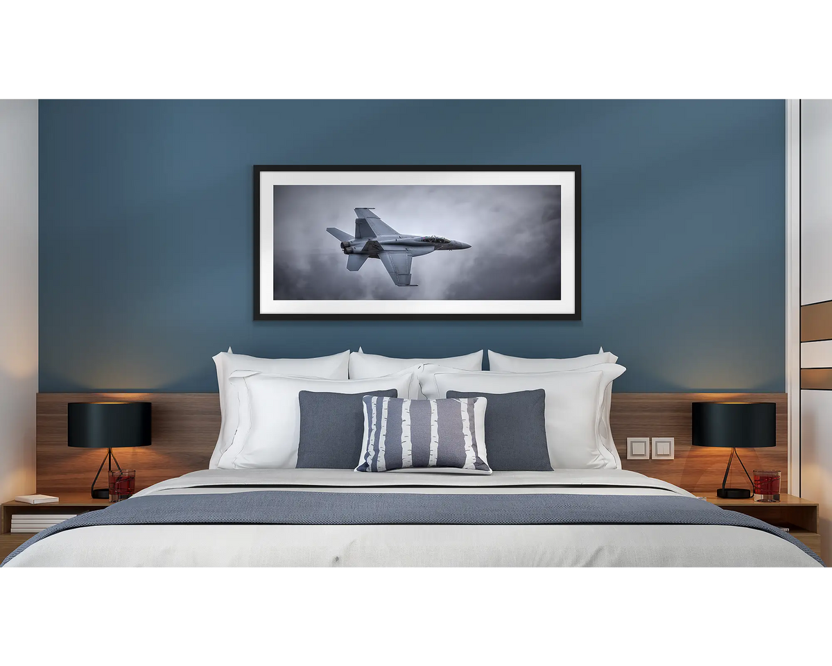 Fighting First. Aviation wall art in a black frame, hanging in a hotel room.