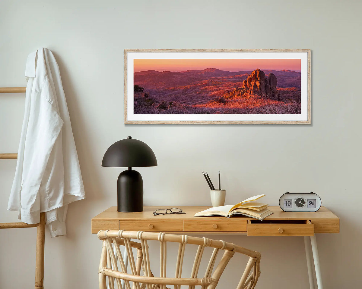 Fire and Rock. The Cathedral, Mount Buffalo wall art print in wood frame above small table.