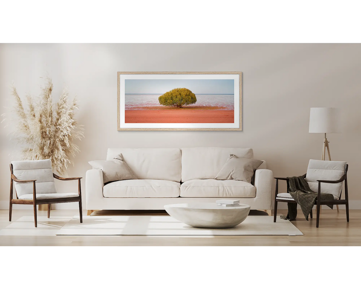 Focus. Broome wall art print, with a Tassie oak frame, above a couch. 