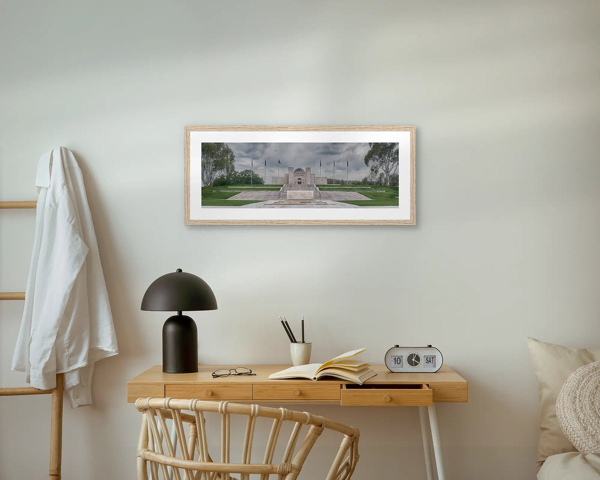 For the Fallen. Australian War Memorial, wall art print with an oak frame, above a bedside table.