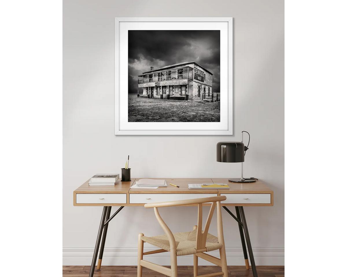 Forgotten Pub. Yatina Hotel wall art in a white frame above a desk. 