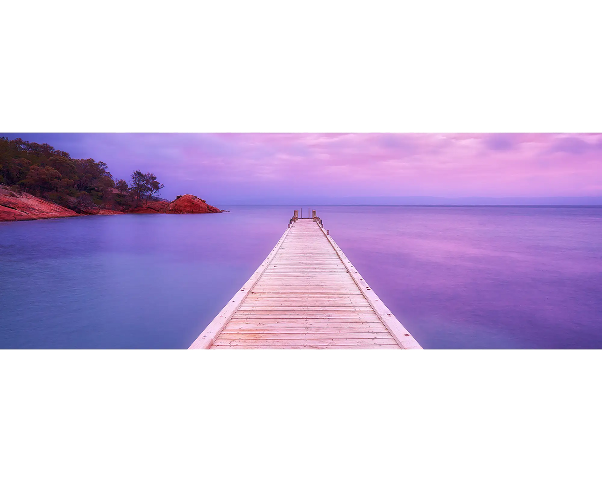 Sunrise over the jetty at Oyster Bay.