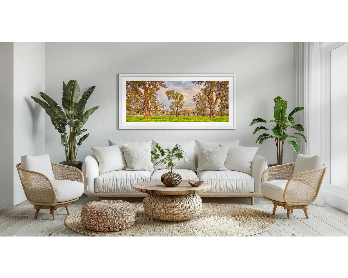 Gundagai Heritage. Country wall art print, with a white frame, above a couch. 