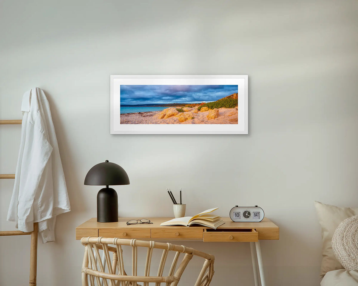 Hamelin Sunset. Hamelin Bay, coastal wall art print, with a white frame, above a bedside table. 