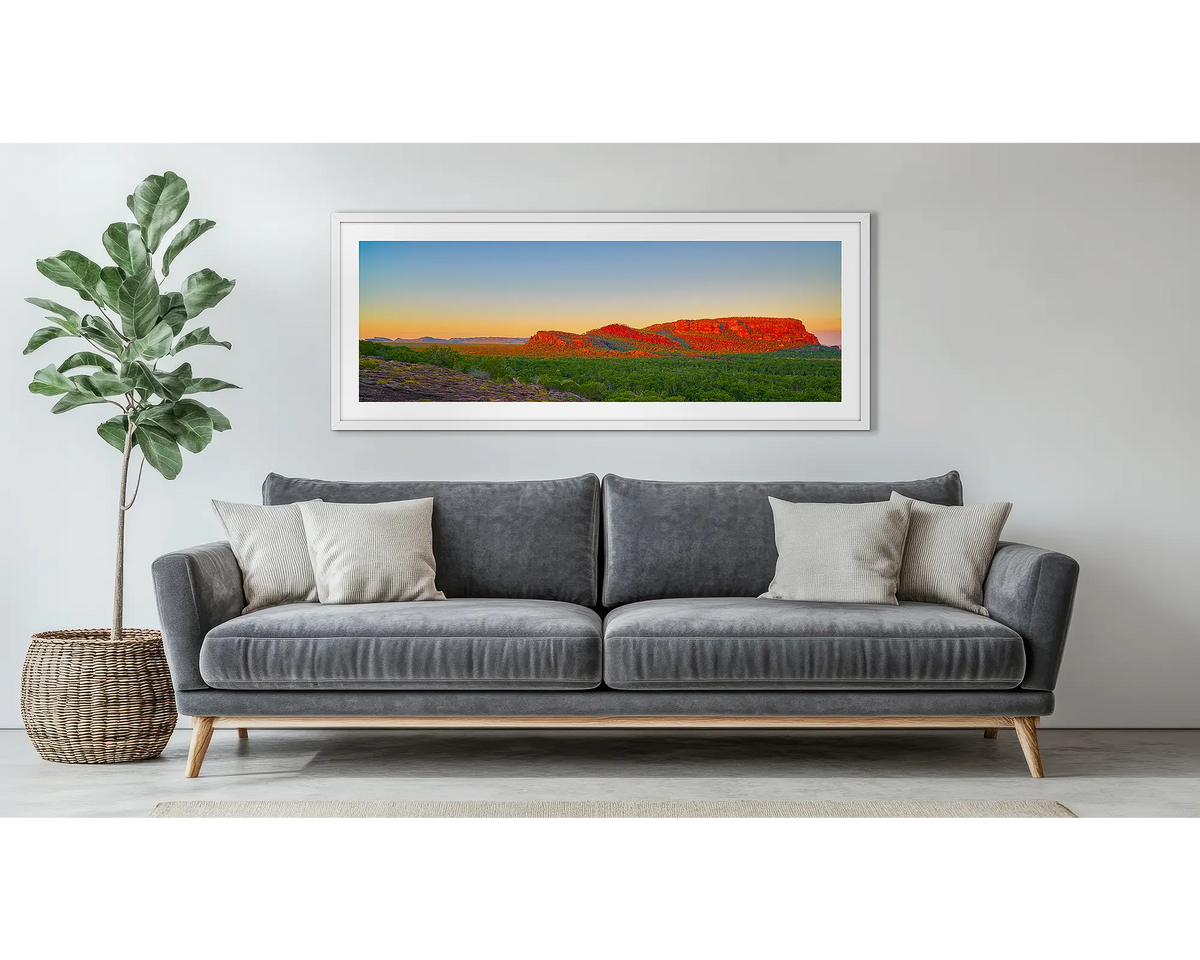 Heart of Kakadu. Wall art in a white frame above a grey couch. 