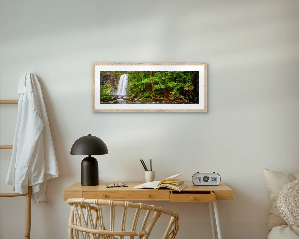 Hopetoun Falls. Waterfall wall art print, with an oak frame, above a bedside table. 