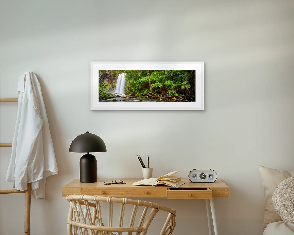 Hopetoun Falls. Waterfall wall art print, with a white frame, above a bedside table. 