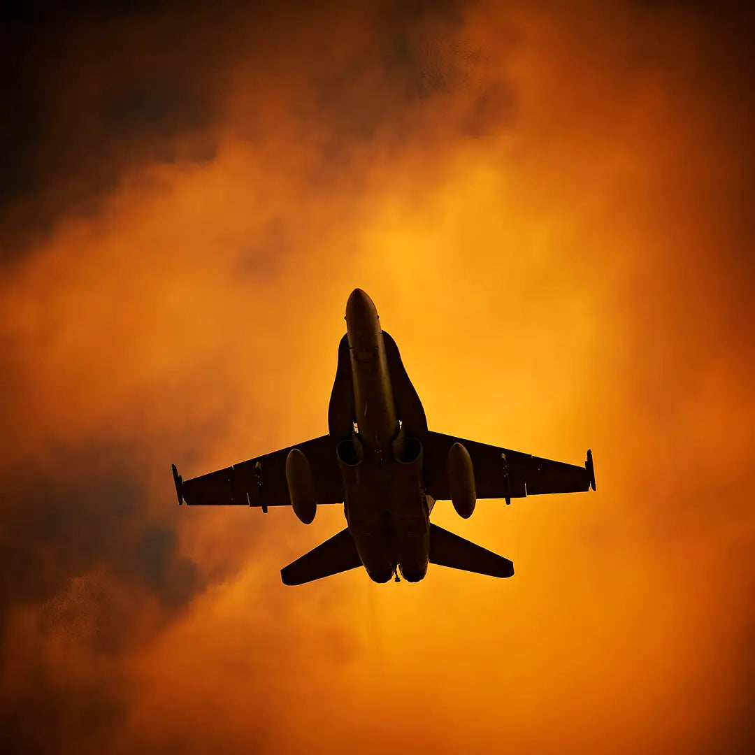 Hornet. Australian Air Force F/A-18 hornet flying against backdrop of orange clouds.