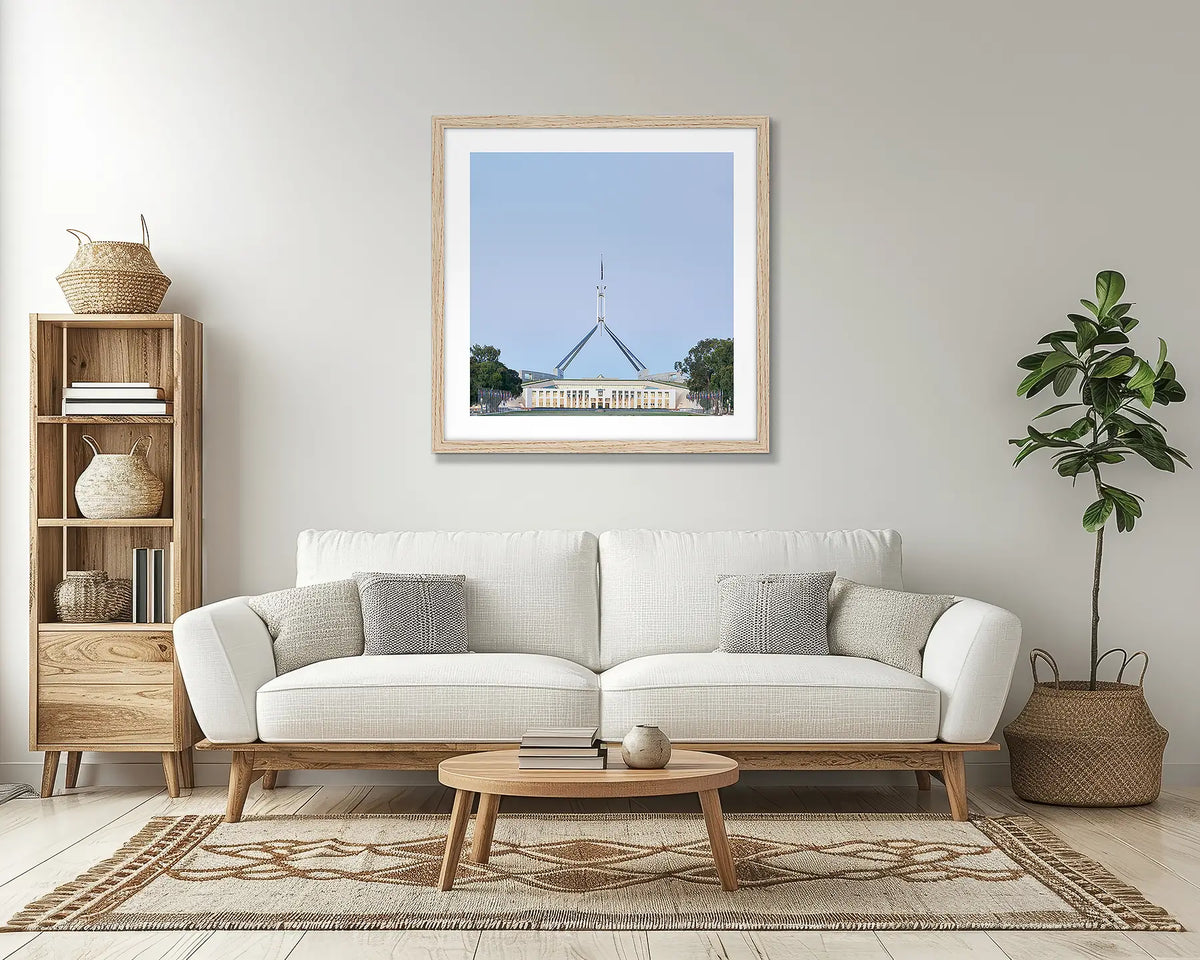 House on the Hill. Parliament House Canberra wall art print, with a timber frame, in a lounge room. 