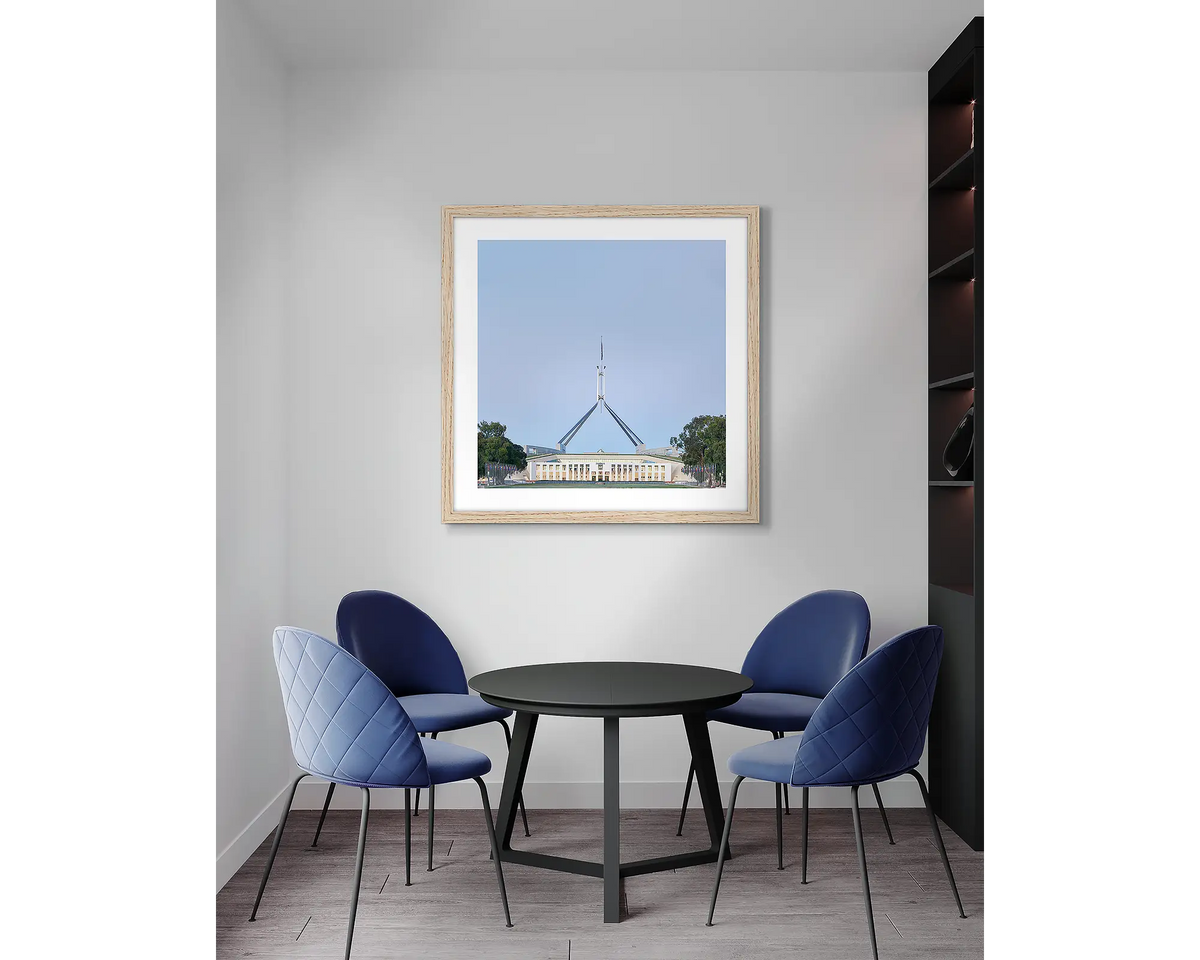 House on the Hill. Parliament House, wall art print, with a timber frame, in an office meeting room. 