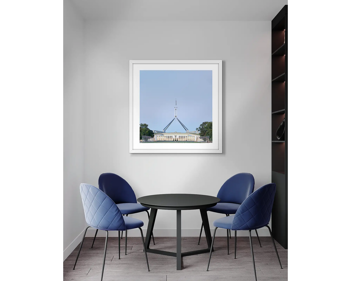 House on the Hill. Parliament House, wall art print, with a white frame, in an office meeting room. 