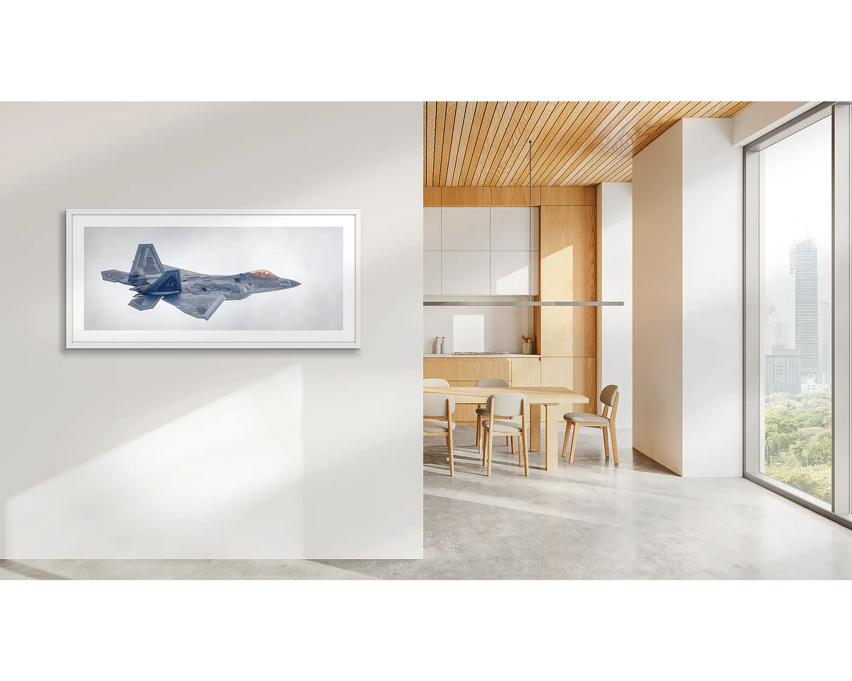 Inbound. F-22 Raptor artwork with a white frame, in a CBD office. 