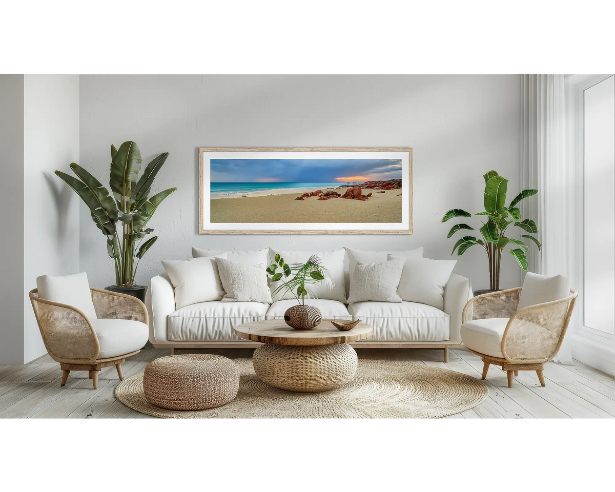 Incoming. Coastal wall art print, with a Tassie oak frame, above a couch. 