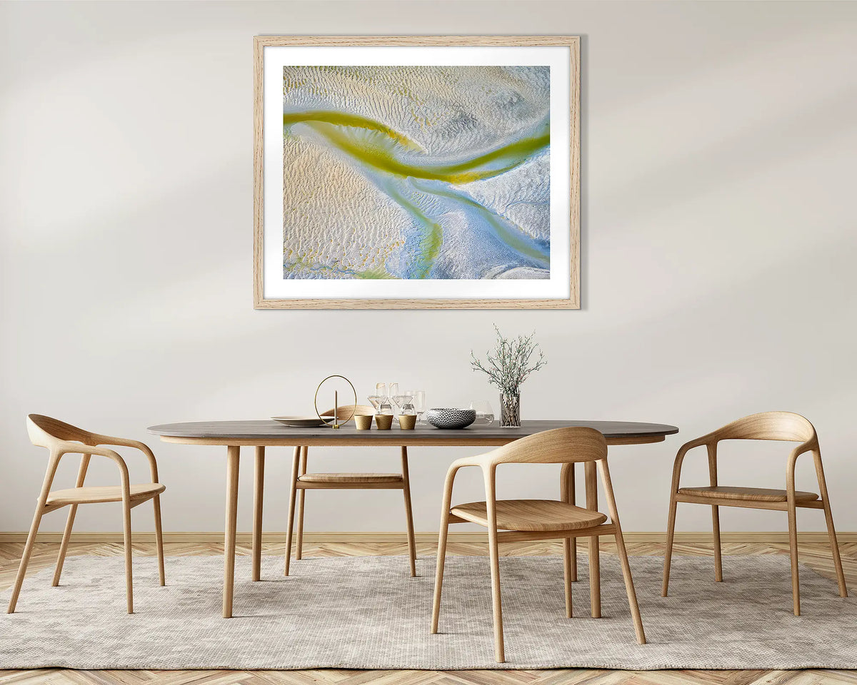 Jellyfish. Tidal patterns, abstract wall art print with an Oak frame, above a dining room table.