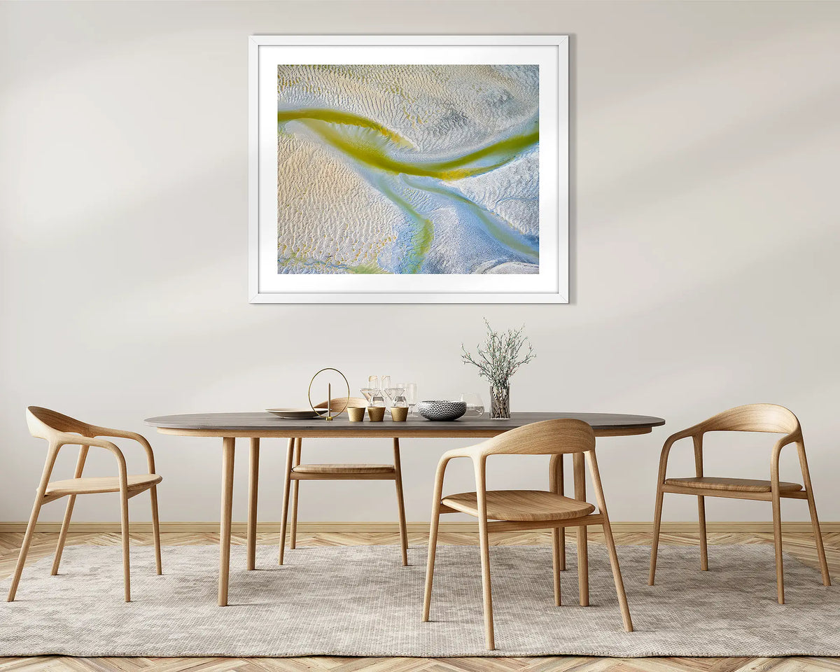 Jellyfish. Tidal patterns, abstract wall art print with a white frame, above a dining room table.