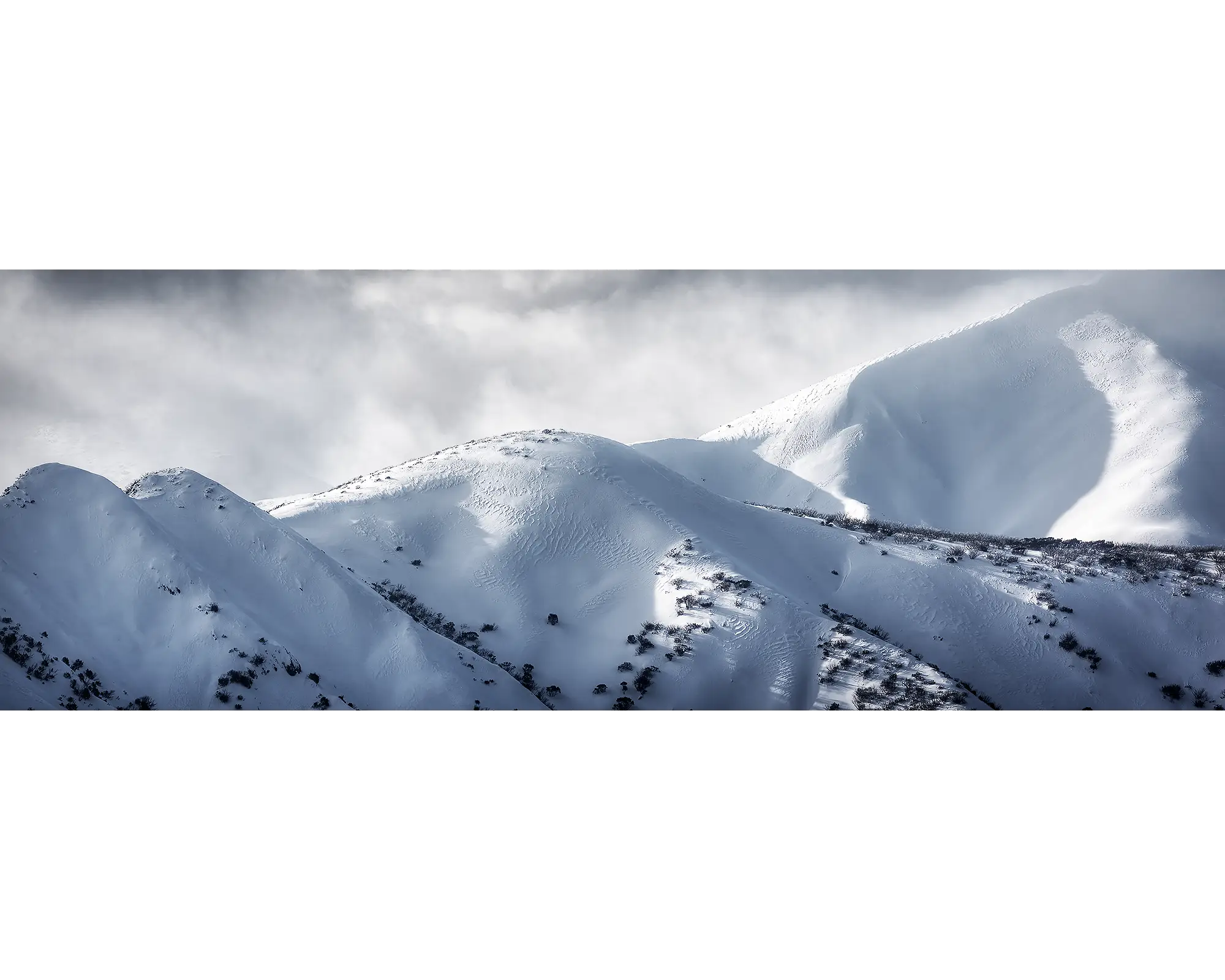 Clouds lingering above the Razorback and Mount Feathertop, Alpine National Park, Victoria. 