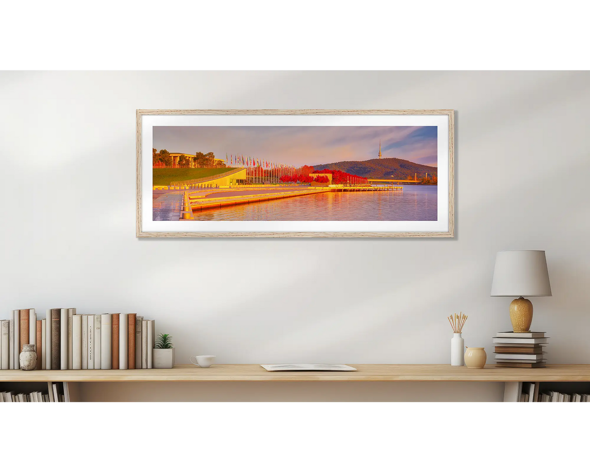 Lakeside Autumn. Canberra wall art print with a Tasmanian oak frame in a study. 