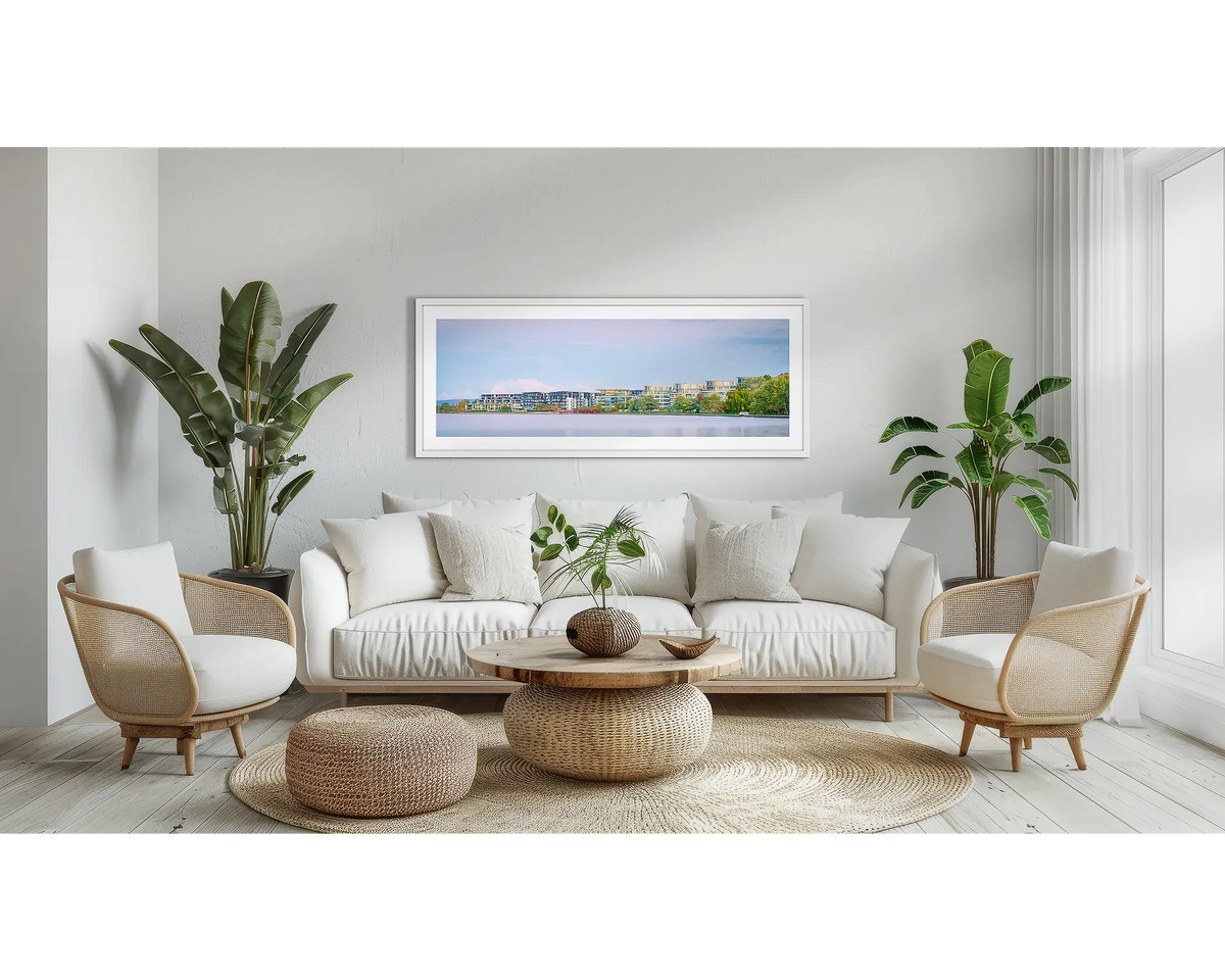 Lakeside. Canberra wall art print, with a white frame, above a couch. 