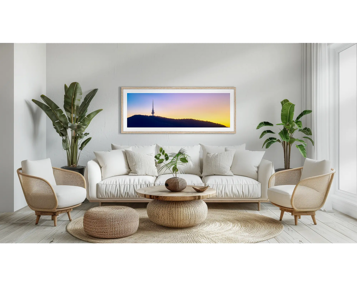 Landmark. Black Mountain Tower wall art print, with a Tassie oak frame, above a couch. 