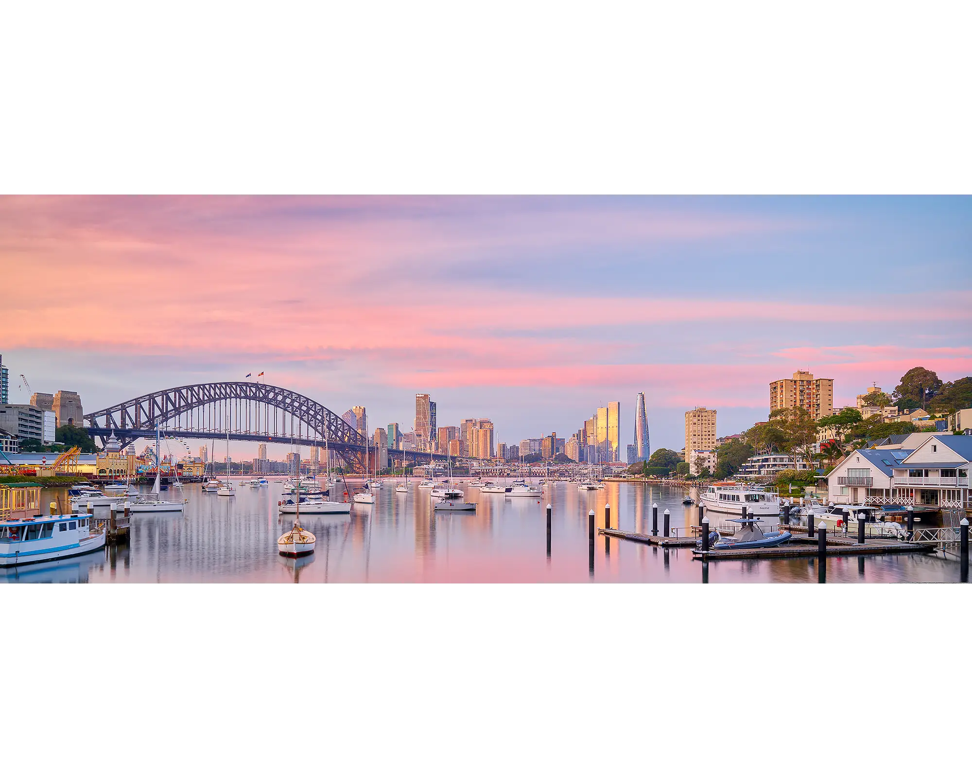 Pink sunrise over Sydney Harbour Bridge and Lavender Bay, Sydney.