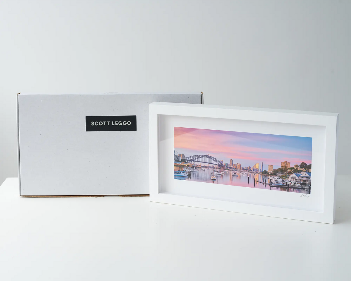 Lavender Sunrise. Pink sunrise over Sydney Harbour Bridge and Lavender Bay, Sydney. Wall with a box. 