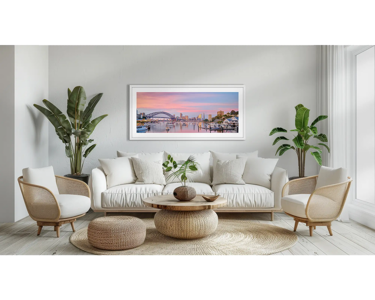 Lavender. Sunrise. Sydney wall art print, with a white frame, above a couch. 