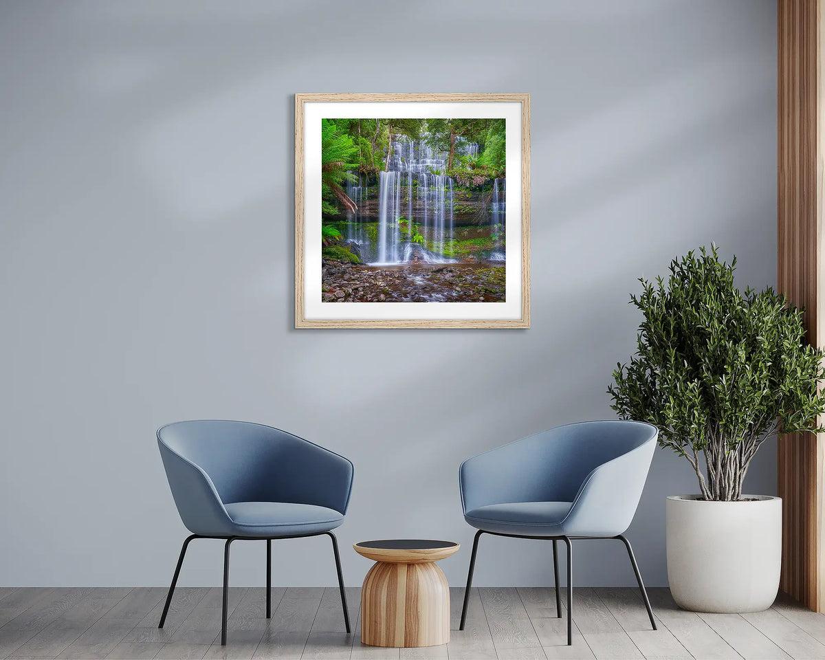 Layers. Tasmania waterfall, wall art print, with a timber frame, in a sitting room. 