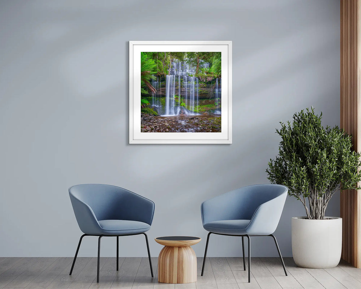 Layers. Tasmania waterfall, wall art print, with a white frame, in a sitting room. 