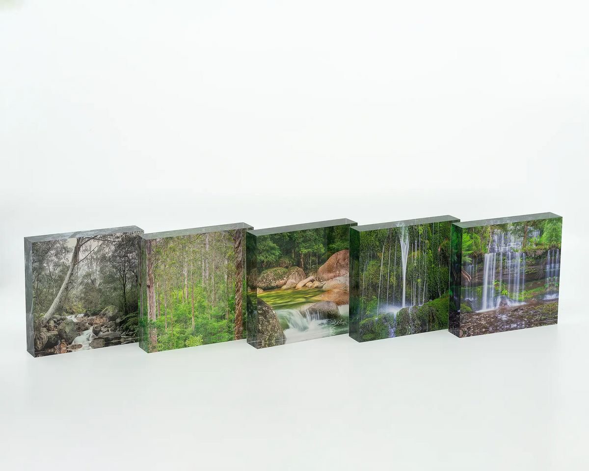 Layers acrylic block displayed with other green themed acrylic blocks. 