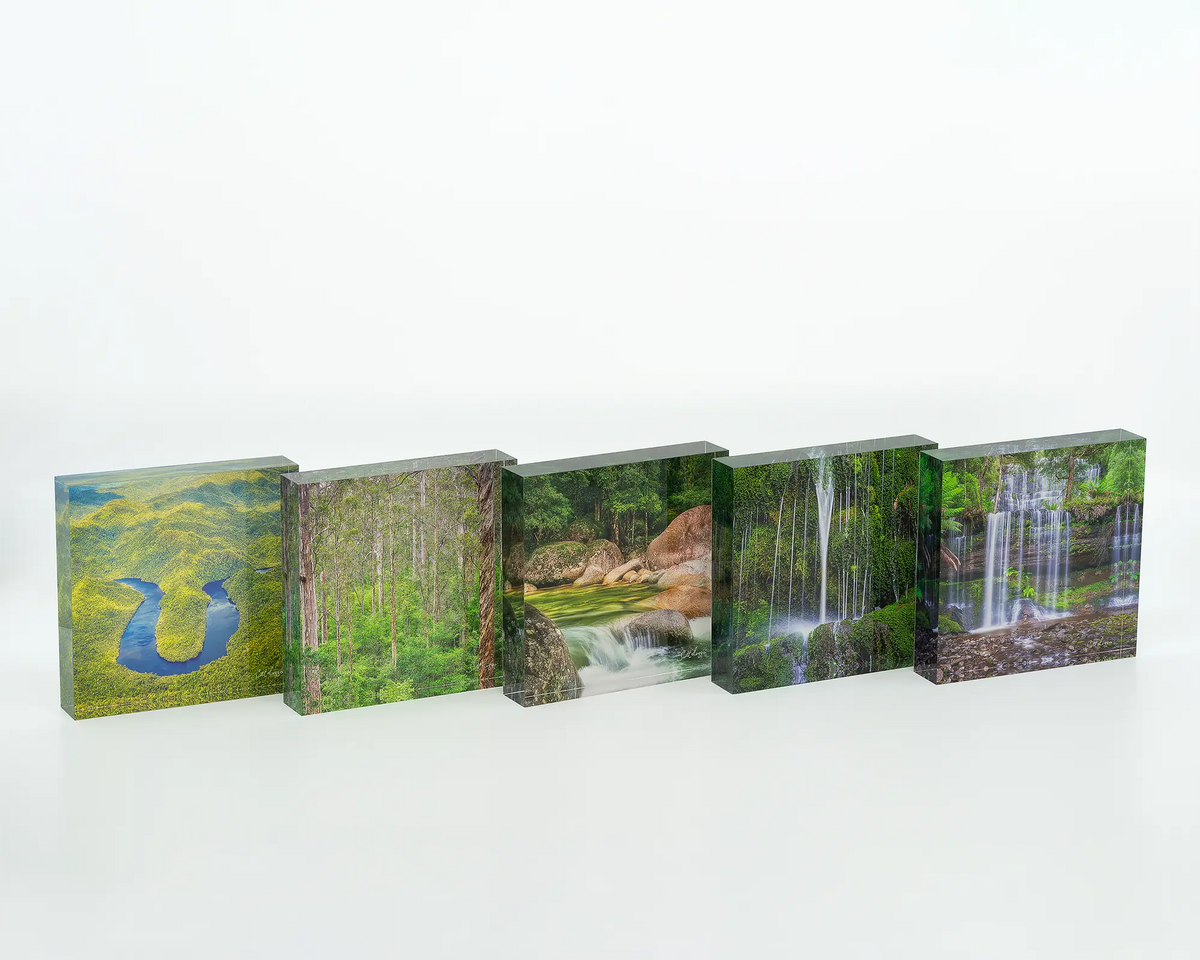 Layers acrylic block displayed with other square green themed acrylic blocks. 