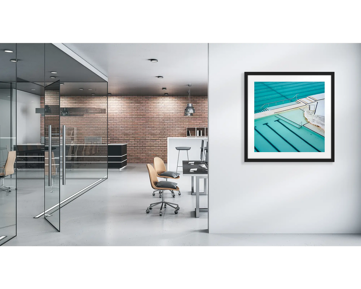 Lines. Bondi Icebergs wall art print, with a a black frame, on a modern office wall. 