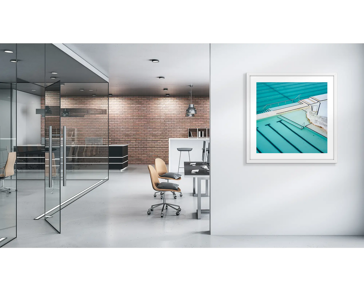 Lines. Bondi Icebergs wall art print, with a white frame, on a modern office wall. 