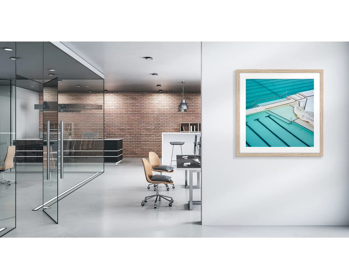 Lines. Bondi Icebergs wall art print, with a a wood frame, on a modern office wall. 