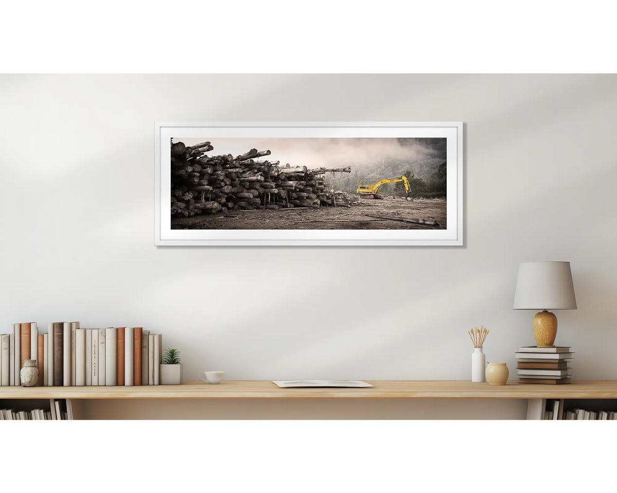 Logging. Buckland Valley wall art print, with a white frame, hung above a bookshelf. 