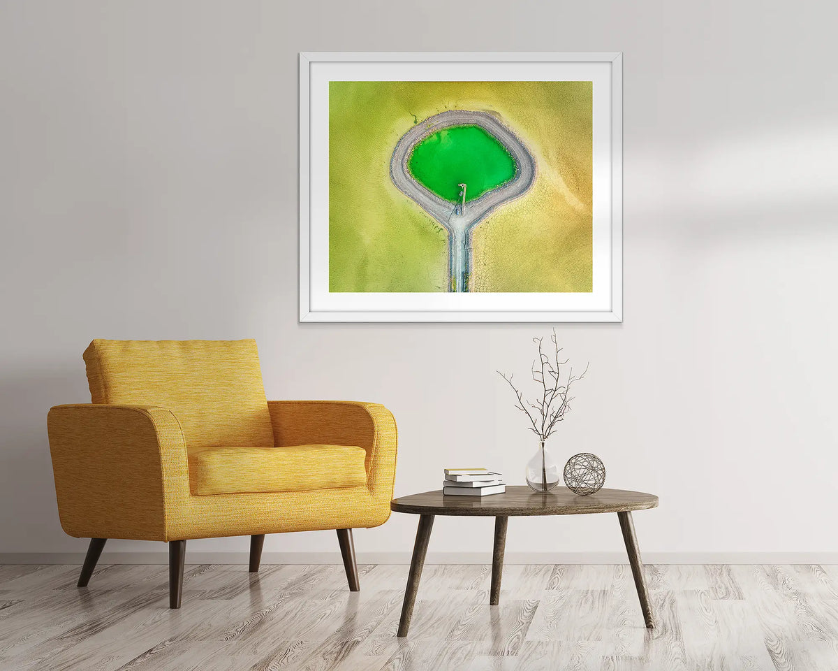 Looking Glass. Wall art print in a white frame, of dam tailings, from above. 