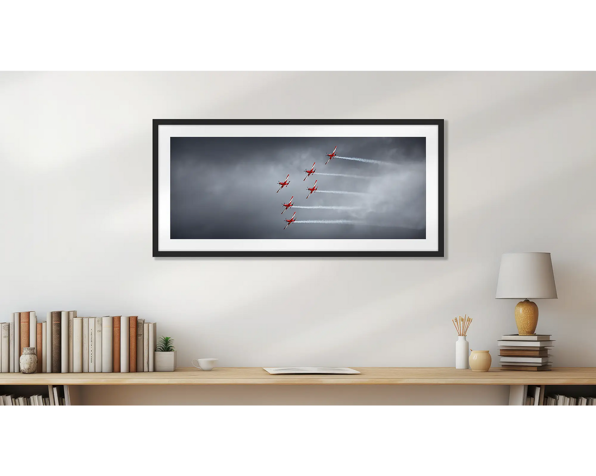 Low Show. RAAF Roulettes wall art print, with a black frame, hung above a bookshelf. 