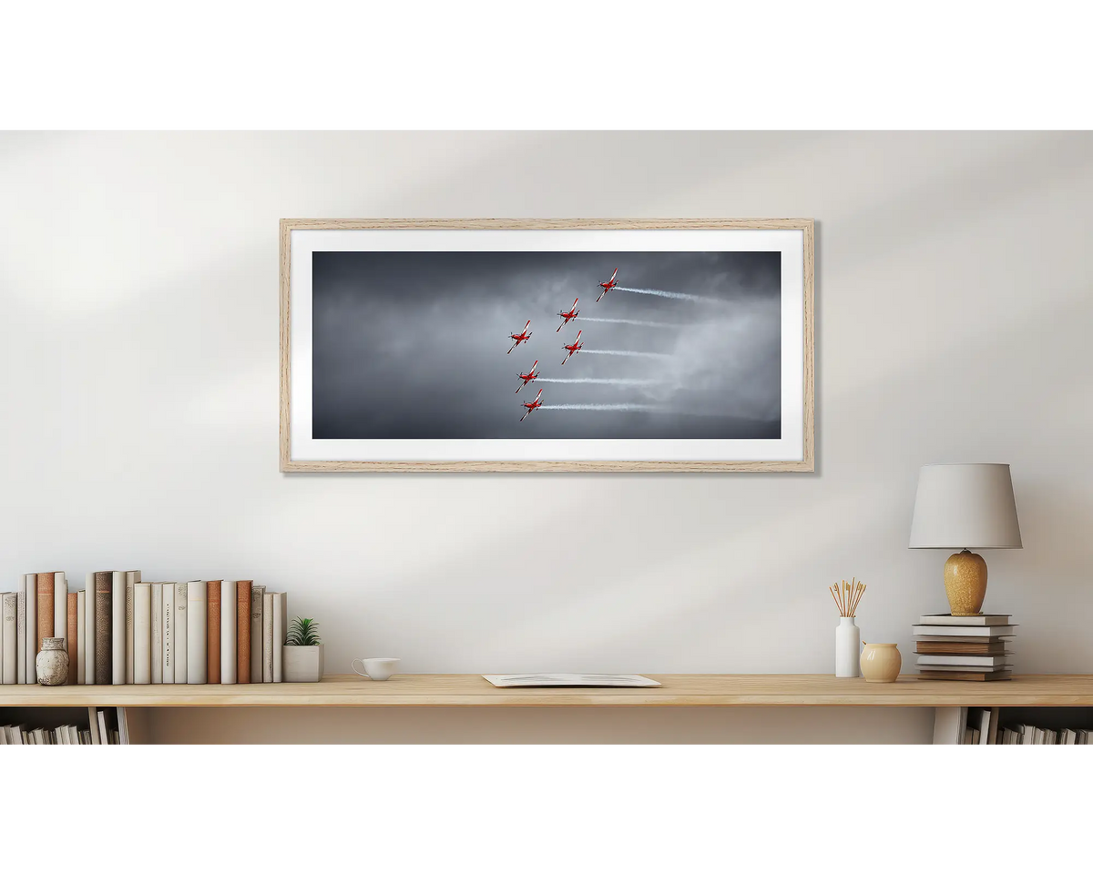 Low Show. RAAF Roulettes wall art print, with a timber frame, hung above a bookshelf. 