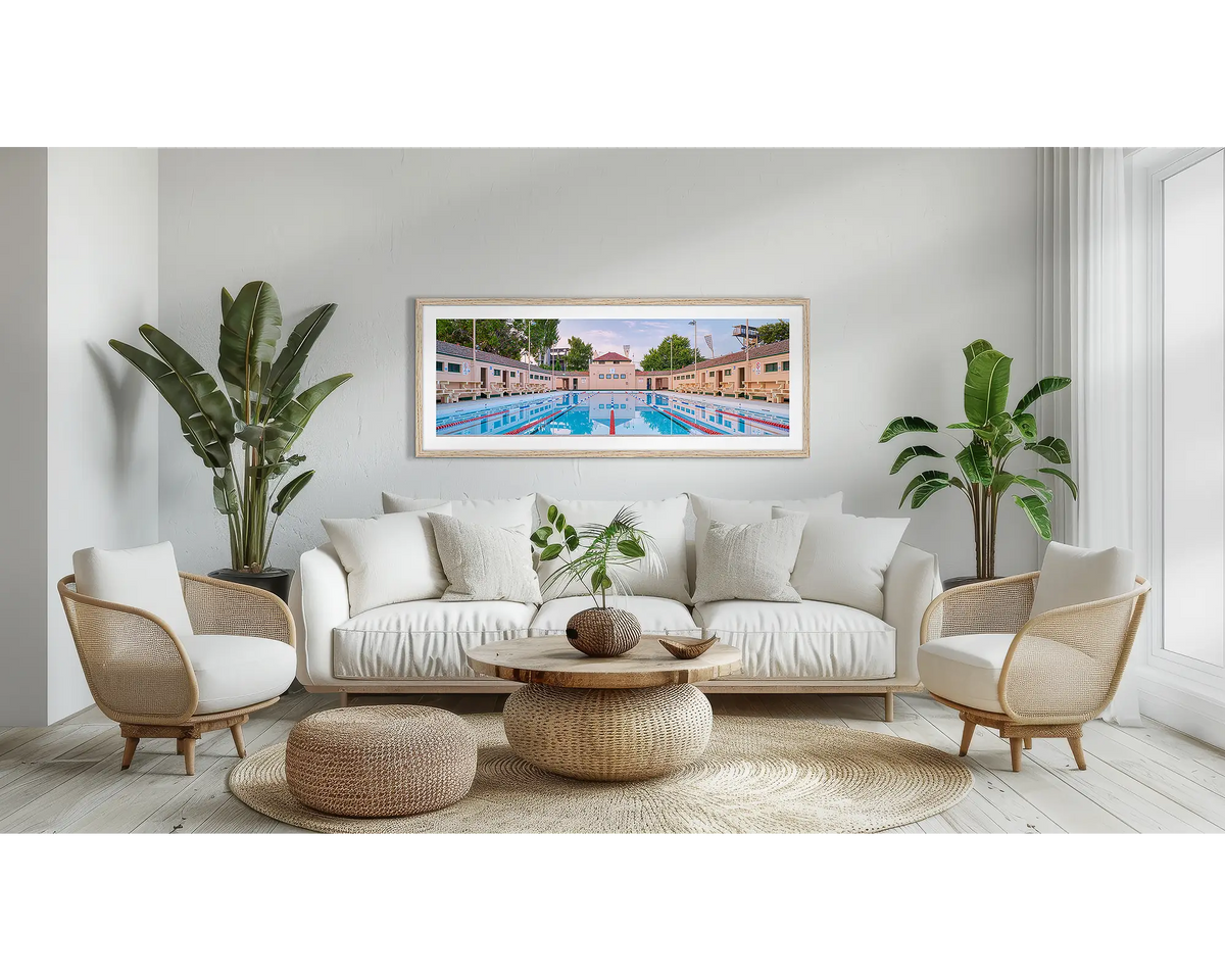 Manuka Morning. Canberra wall art print, with a Tassie oak frame, above a couch. 