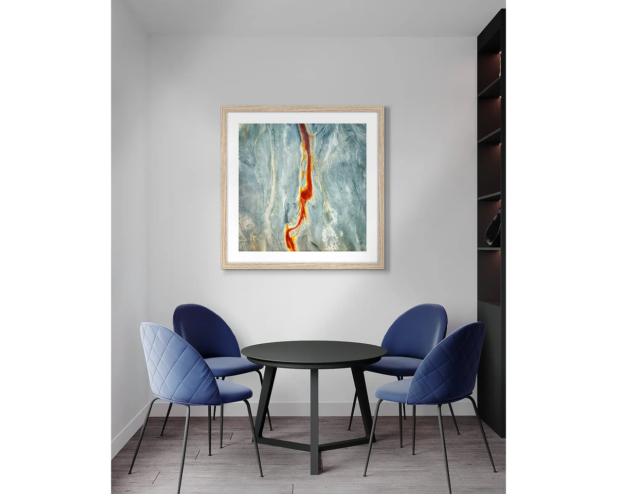 Median. Aerial abstract, wall art print, with a timber frame, in an office meeting room.