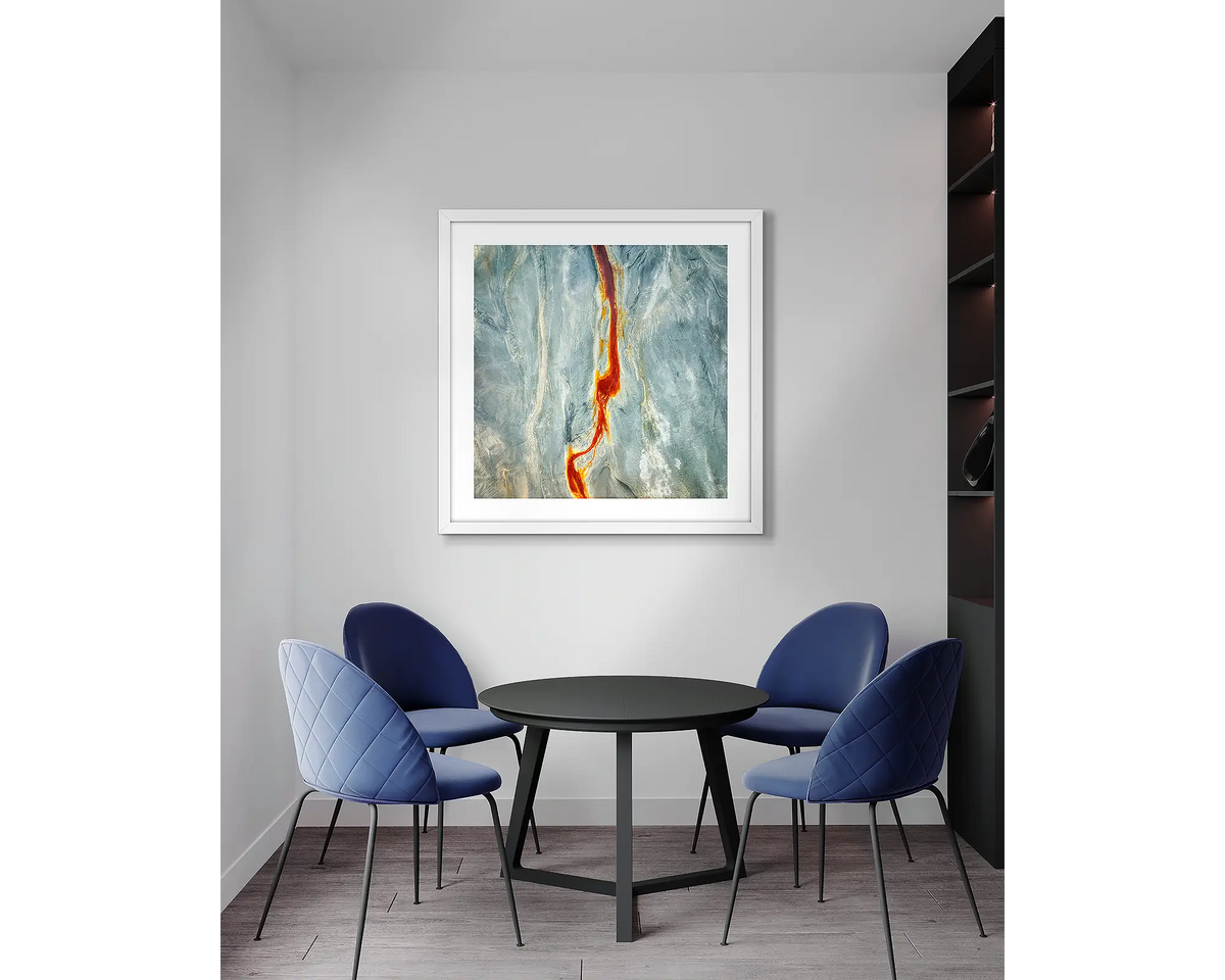 Median. Aerial abstract, wall art print, with a white frame, in an office meeting room.