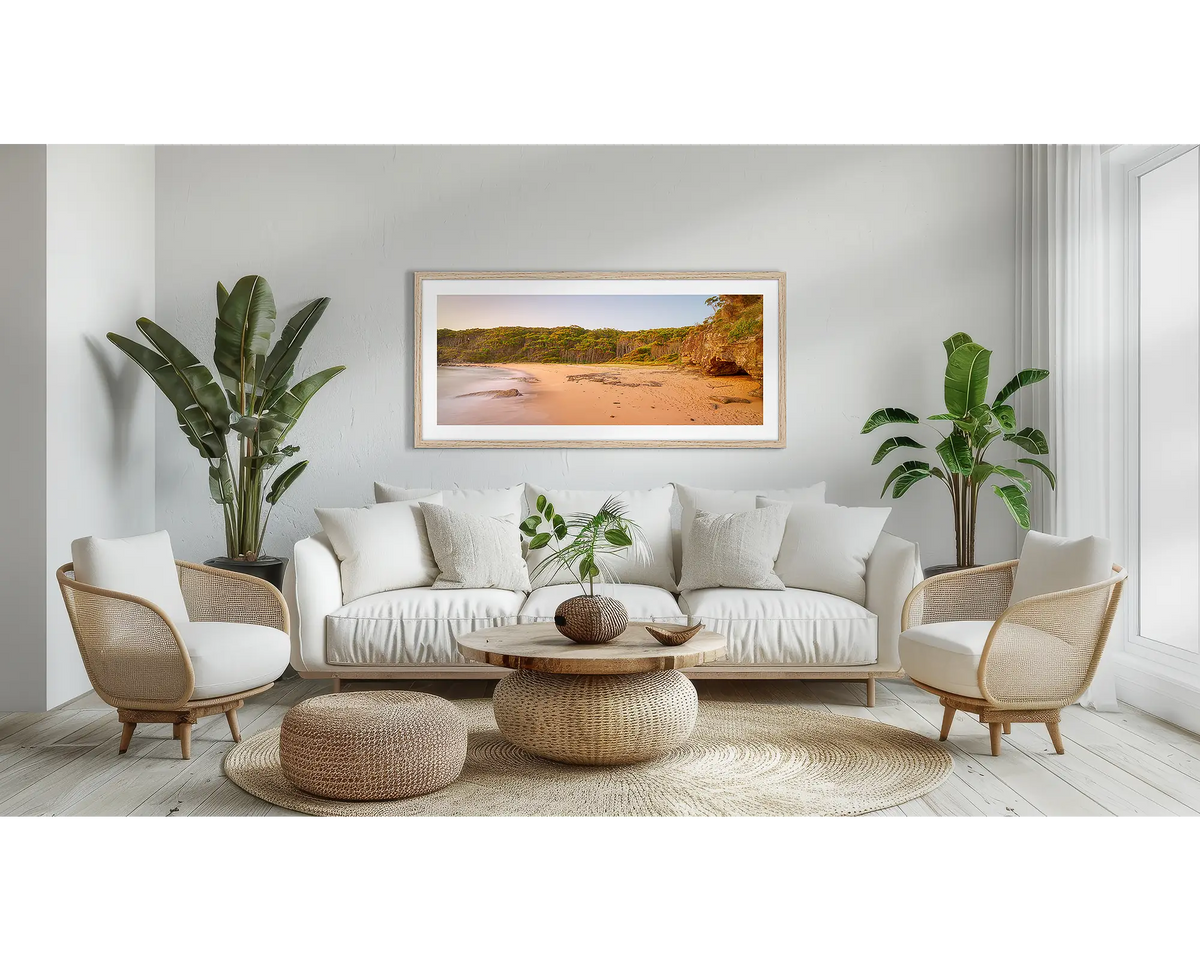 Miller Chill. South Coast wall art print, with a Tassie oak frame, above a couch. 