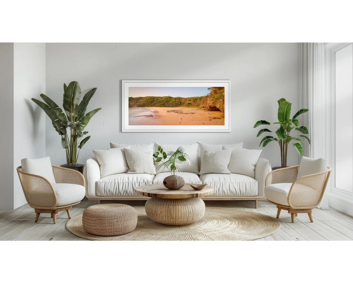 Miller Chill. South Coast wall art print, with a white frame, above a couch. 