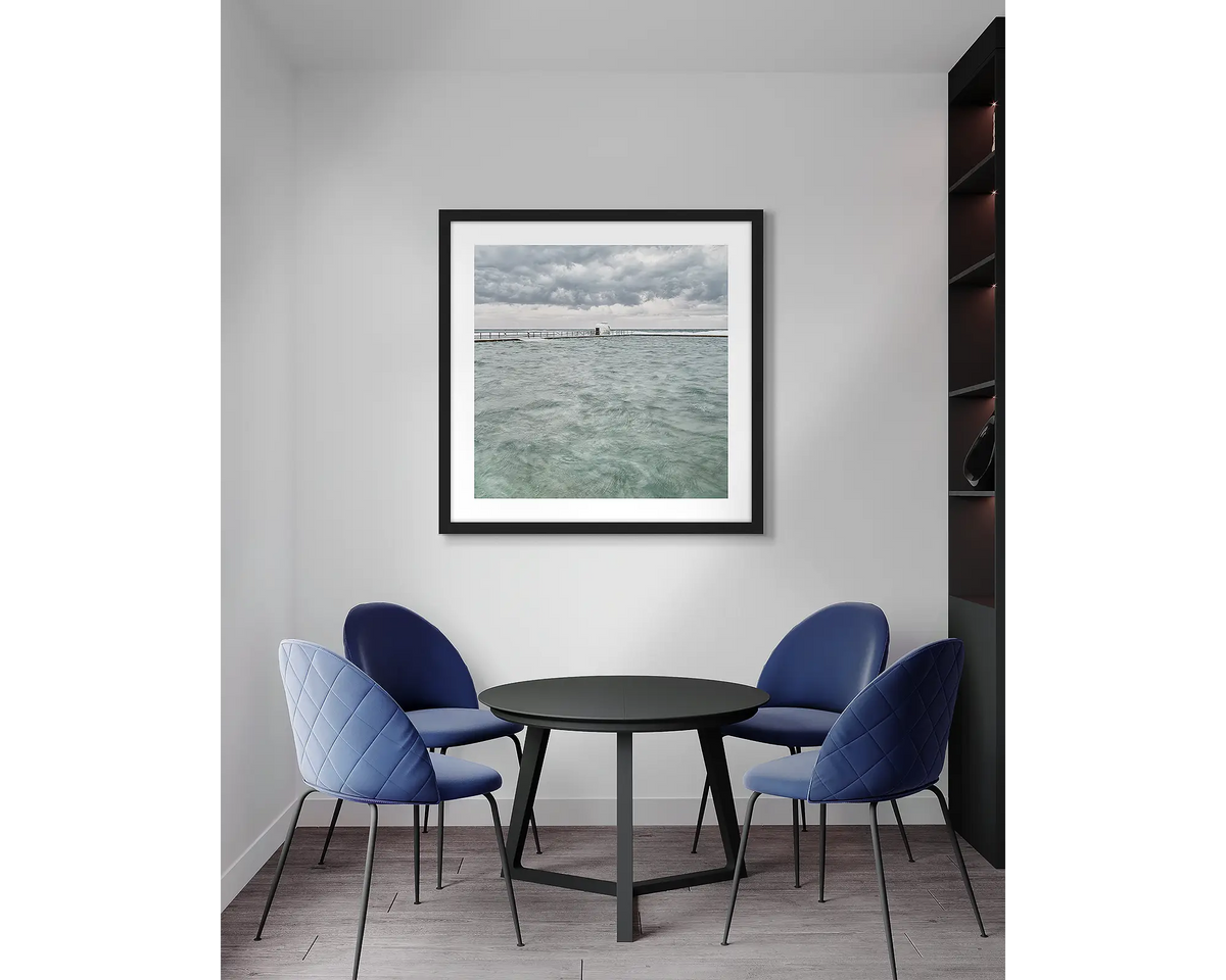 Moody Merewether. Newcastle, wall art print, with a black frame, in an office meeting room.