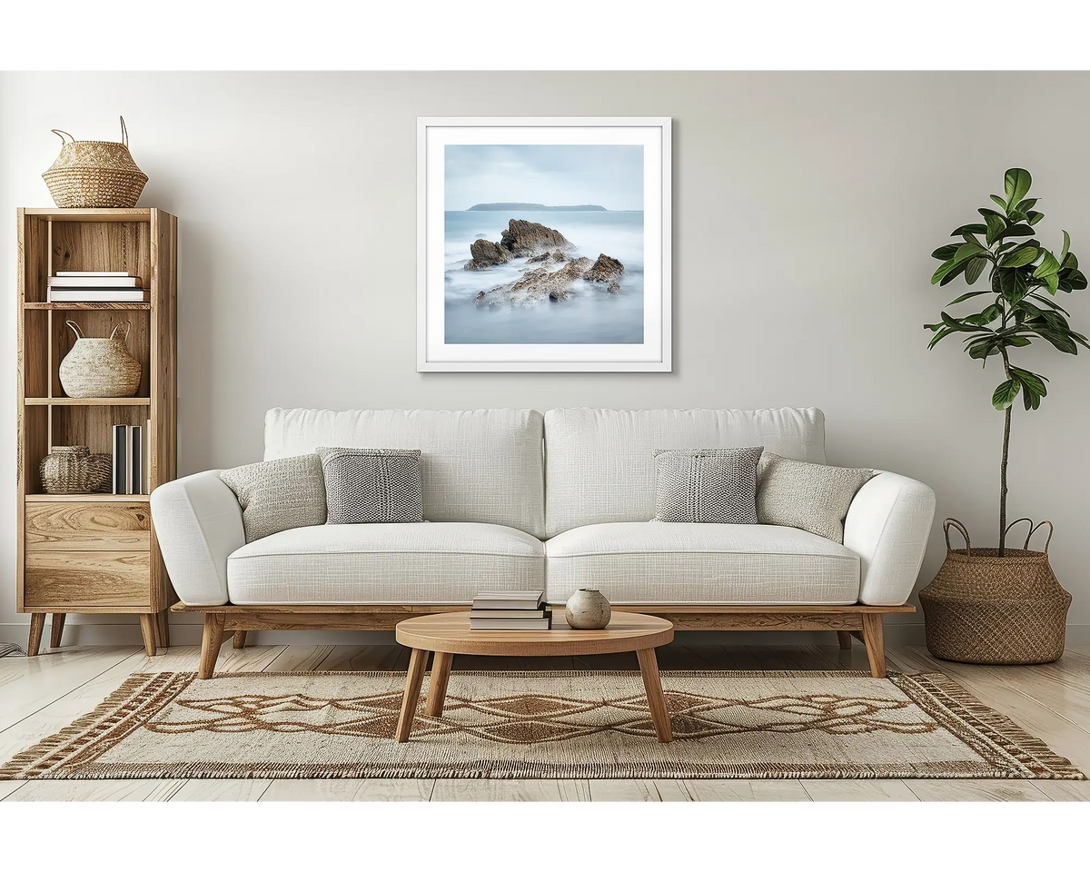 Mossy Point. South coast wall art, with a white frame, in a lounge room, above a couch. 