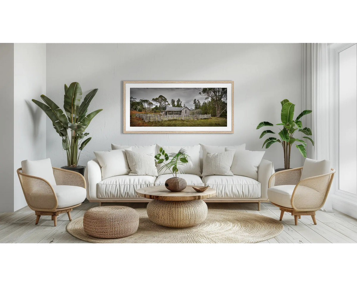 Mount Kate House. Tasmanian wall art print, with a timber frame, above a couch. 