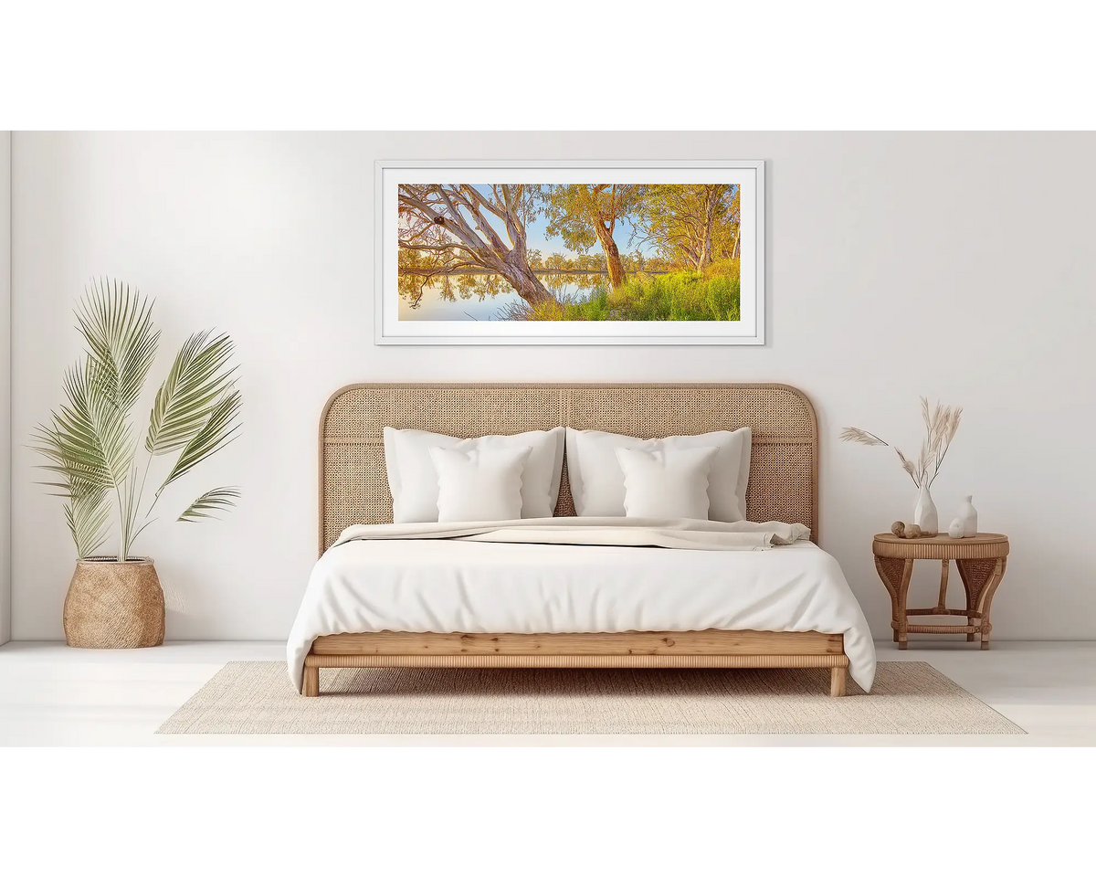 Murray Sunrise. South Australian wall art, in a white frame, in a bedroom. 